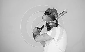 Bearded gamer with agitated look training batting skills, simulation game concept. Man with stylish beard posing with