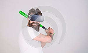 Bearded gamer with agitated look training batting skills, simulation game concept. Man with stylish beard posing with