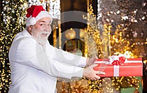 Bearded grandfather man celebrate christmas. Christmas gift. Happy Santa Claus. Joyful present well remembered past