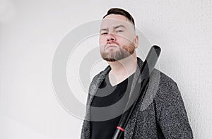 Bearded guy hold baseball bat