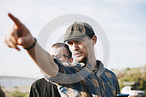 Bearded guy shows a way in nature