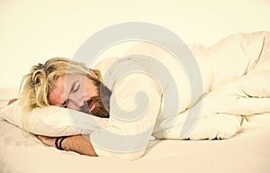 bearded guy wear white terry bathrobe sleeping on bed at hotel bedroom. bed rest while sick. man sleep in underwear. Man