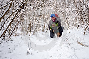 Bearded hiker man is talking to his dog