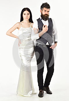 Bearded hipster with bride dressed up for wedding ceremony. Wedding concept. Couple in love, bride and groom in elegant