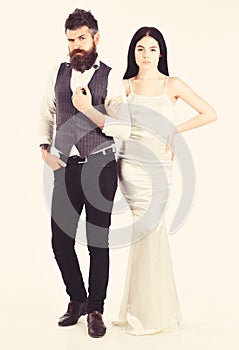 Bearded hipster with bride dressed up for wedding ceremony. Wedding concept. Couple in love, bride and groom in elegant