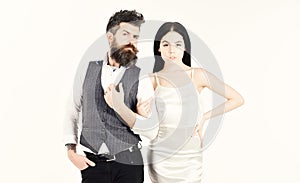 Bearded hipster with bride dressed up for wedding ceremony. Woman in wedding dress and man in vest. Couple in love
