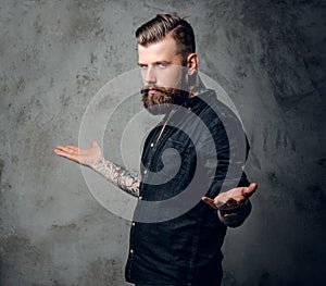 Bearded hipster male in a black shirt.