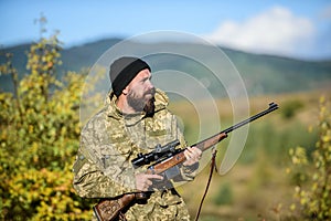 Bearded hunter spend leisure hunting. Focus and concentration of experienced hunter. Hunting and trapping seasons