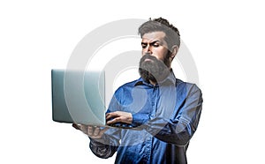 Bearded male businessman holding a computer in his hands isolated on white background. Holding laptop computer. Serious