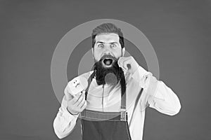 Bearded man in apron. Diet and healthy food. Doughnut diet. Calorie. Feel hunger. No diet. Chef man in cafe. baker hold