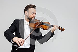 Bearded man artistic violinist performing