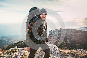 Bearded Man backpacker hiking in mountains