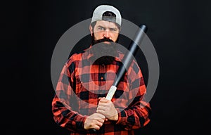 Bearded man with baseball bat. Sport, training, healthy lifestyle. Professional baseball player in cap.