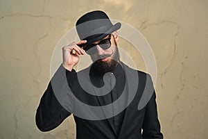 Bearded Man with black Clothes greets