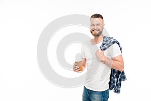 Bearded man with blue checkered shirt on shoulder holding disposable cup in hand,