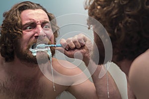 Bearded Man Brushing Teeth