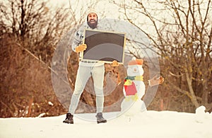 bearded man build snowman. Happy new year. winter season. Christmas sales. winter holiday. Party here. man advertising