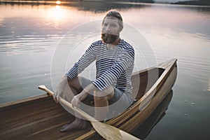 Bearded man in canoe