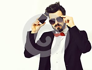 Bearded man, caucasian hipster with moustache, sunglasses and perfume bottle