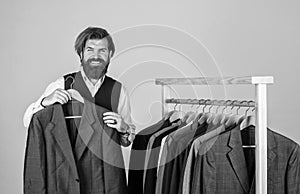 Bearded man collector vintage clothes showing formal suit, tweed jacket concept