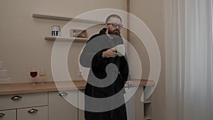 Bearded man with cup of tea