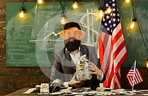 Bearded man with dollar money for bribe. Income planning of budget increase policy. Economy and finance. Patriotism and