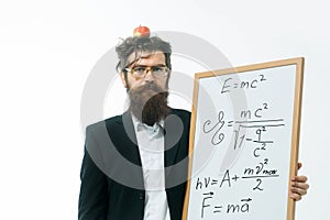 Bearded man with einstein formula and newtons law