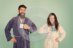 Bearded man and girl coffee cup. Couple enjoy lazy weekend. they feel rested. family life and routine. couple in love