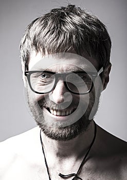 Bearded man in glasses plays the fool. crazy man, funny expression