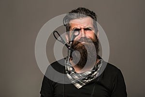 Bearded man with hairdresser scissors