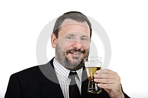 Bearded man has a drink lager