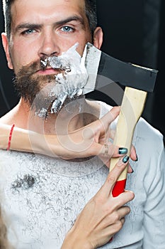 Bearded man having shaved
