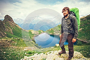 Bearded Man hiker with backpack mountaineering photo