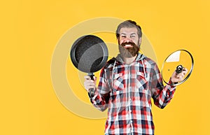 Bearded man hold kitchen pan. brutal hipster cooking with saucepan. housekeep husband cook in pot. mature chef in