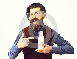Bearded man holding bottle of kefir with happy face
