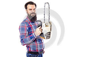 Bearded man holding a chainsaw isolated on a white background