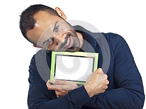 Bearded man holding empty green picture frame