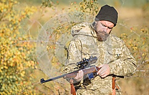 Bearded man hunter. Military uniform. Army forces. Camouflage. Hunting skills and weapon equipment. How turn hunting