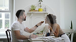 Bearded man husband feeding sharing food with lovely woman Spbd. cute couple eating together