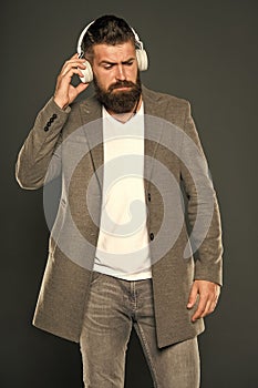 Bearded man listen to music. Man in headphones. Audio book education. brutal caucasian hipster with moustache. Mp3