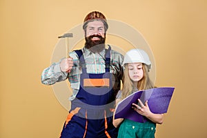 Bearded man with little girl. Fatherhood. engineering education. construction assistant. Family. Industry. Tools for
