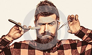 Bearded man, bearded male. Portrait of stylish man beard. Barber scissors and straight razor, barber shop. Vintage