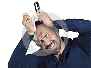 Bearded man with map and magnifying glass