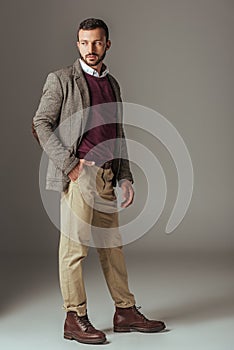 bearded man posing in stylish autumn tweed jacket