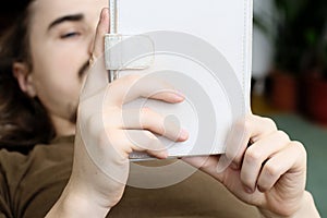 Bearded man reading tablet