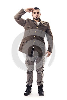 Bearded man saluting while wearing military uniform