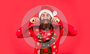 Bearded man santa hat. Changes and improvements. Winter holiday fun. Emotional hipster with mustache winter sweater