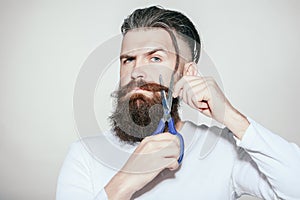 Bearded man with scissors