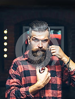 Bearded man with scissors