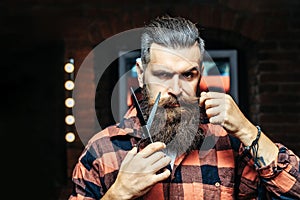 Bearded man with scissors